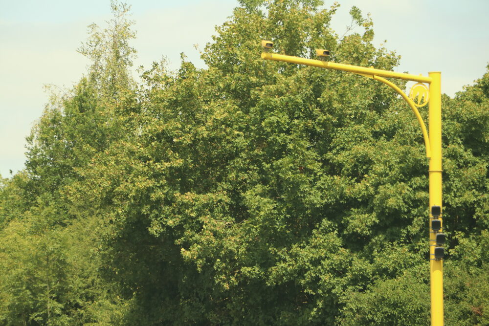 Average speed cameras over a UK dual carriageway like the A20, where 62,000 tickets followed a limit change