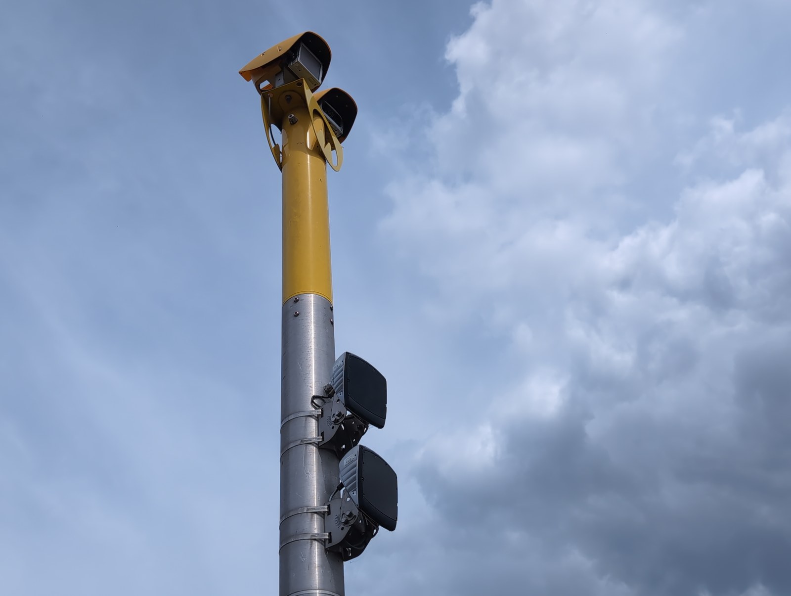 A twin-headed AI camera unit on its pole -- the national rollout arriving street by street