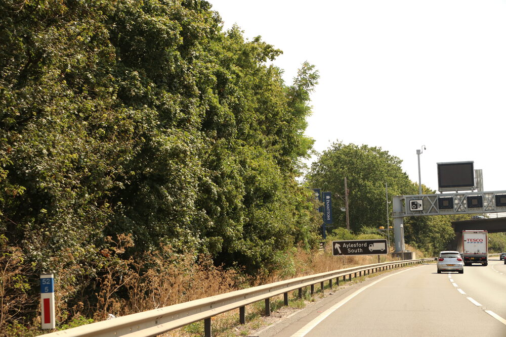 Motorway gantry with enforcement camera above traffic, as used on 60mph air quality speed limit stretches