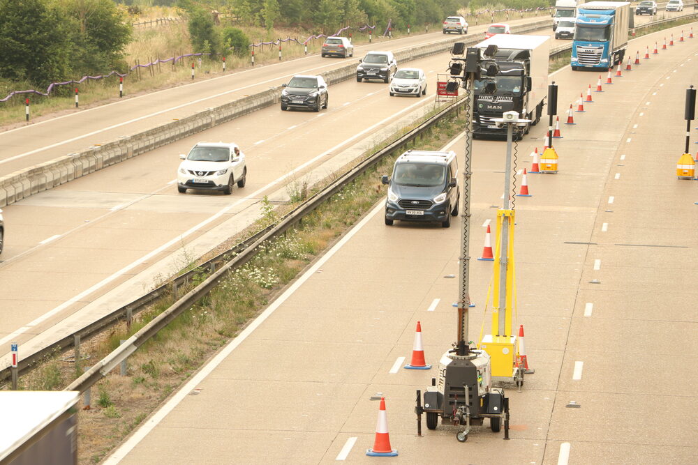 Brake lights glowing in a queue of UK traffic — the braking pattern new speed cameras are designed to catch