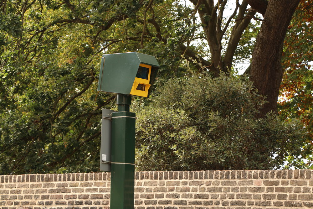 A fixed speed camera on an urban UK road — sites are not always chosen for safety alone