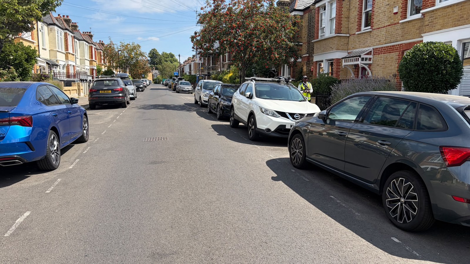 Traffic on a residential street -- phone-at-the-wheel fines have doubled