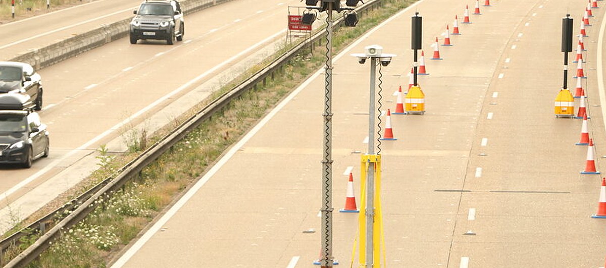 A Driver holding a phone at the wheel -- the law on mobile phone use while driving