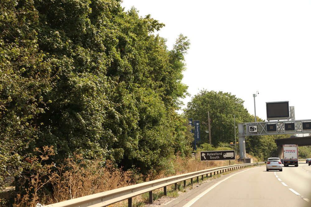 Overhead camera gantry on a fast UK road — one stretch generated 22 tickets for a single driver