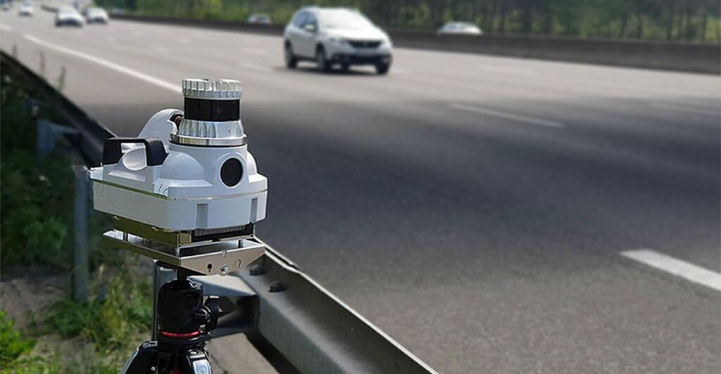 A tall grey pole with a compact rotating camera unit on top, like the 360-degree Parifex Nano