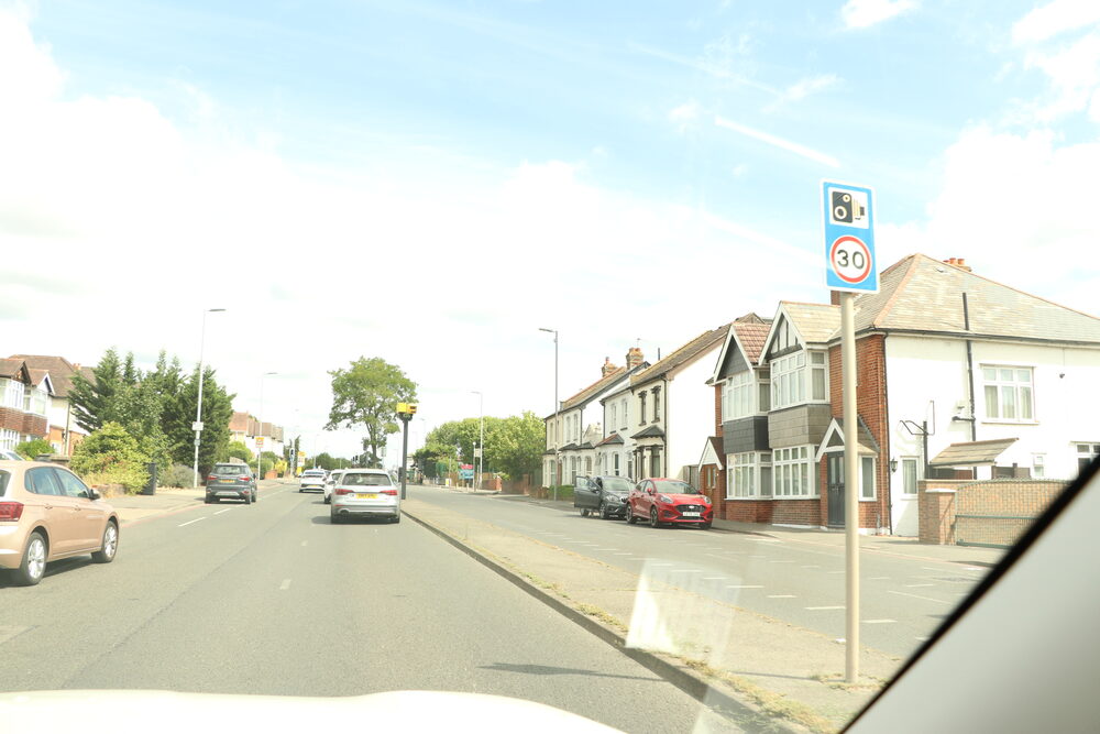 A 30mph residential street from the driver's seat — where police roadside discretion decides who gets points
